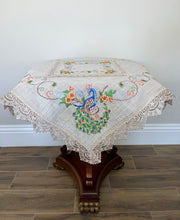 Load image into Gallery viewer, Floris Linens Peacock Embroidered Table Topper with Lace, Natural Linen Color
